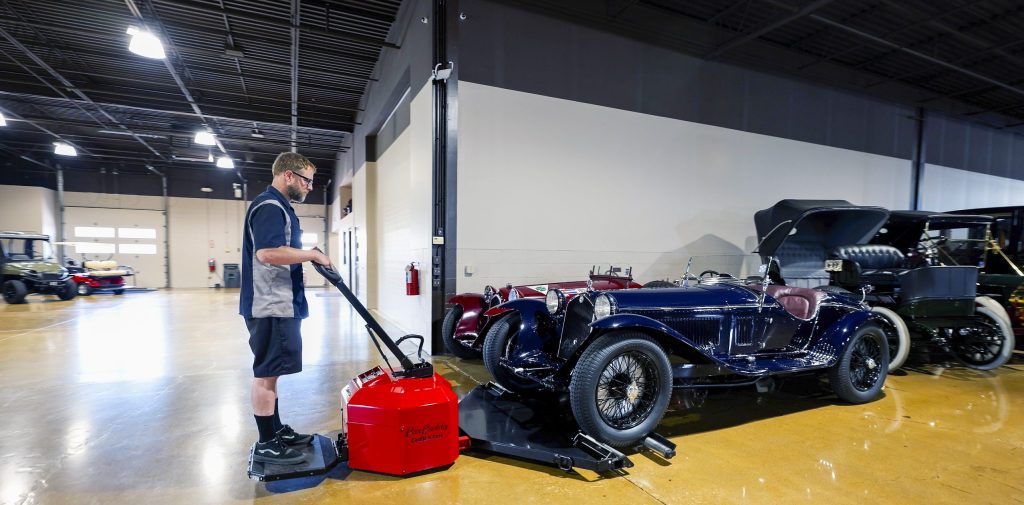 Employee learning how to safely operate a vehicle mover