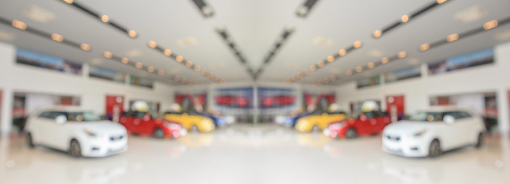 Boutique Car Dealership utilizes an electric vehicle mover for parking tetris.